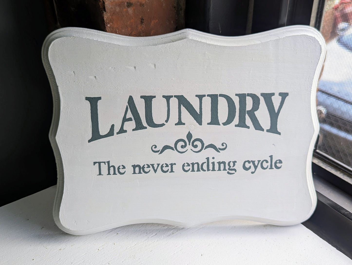 white laundry sign- laundry never ending sign