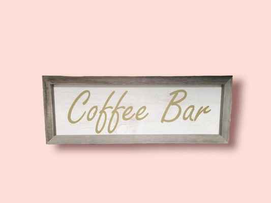 Rectangle Coffee bar sign with gold cursive lettering that says “coffee bar”