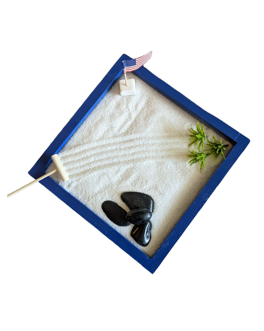 Blue 8"x8" miniature zen garden tray filled with sand and styles with accents.