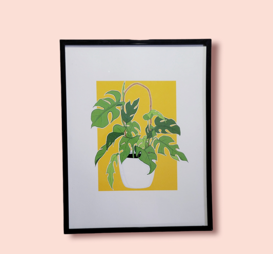 yellow background plant art print in black frame
