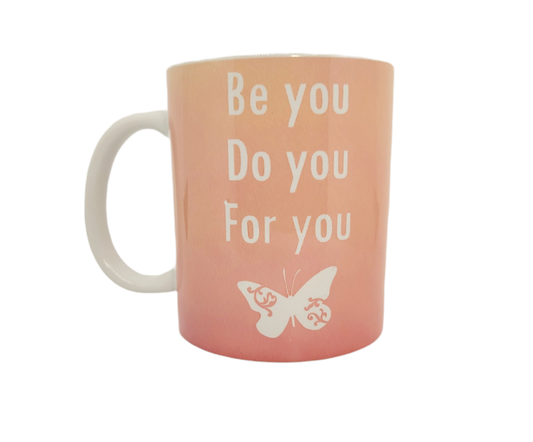Pink 11 oz ceramic coffee mug that says be you do you for you 