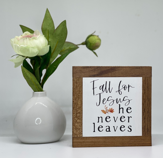 Small honey stained sign that says Fall for Jesus he never leaves. Humorous religious fall sign. 