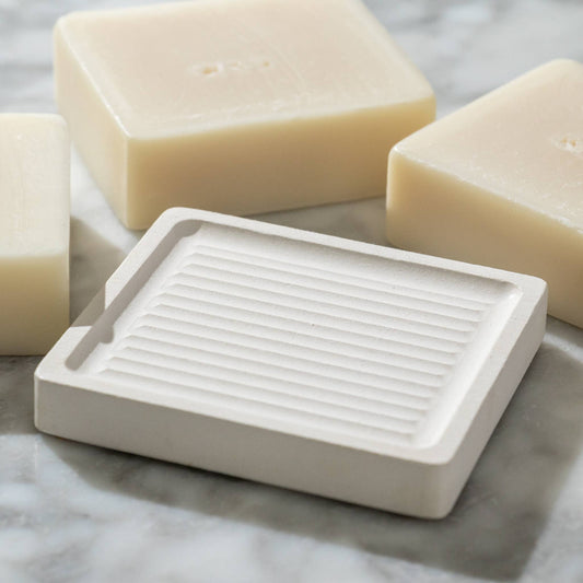 white earth stone soap dish with antibacterial properties.